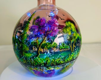 A hand painted and fired glass vase by Andrew Jenkins