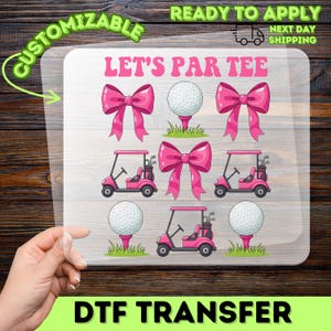 May include: A DTF transfer sheet with a golf theme. The design includes pink bows, golf balls on tees, and pink golf carts. The text "LET'S PAR TEE" is displayed in pink. The words "CUSTOMIZABLE" and "READY TO APPLY" are also visible.
