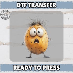 May include: A cartoon character with a surprised expression. The character is an oval shape with large eyes, a gaping mouth, and spiky hair. The image includes the text "DTF TRANSFER" and "READY TO PRESS".