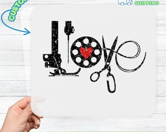 May include: A white DTF transfer with a black design spelling "love" using sewing machine parts, a spool with a red heart, and scissors. The words "Customizable" and "Ready to Apply" are also present.