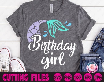 May include: A gray t-shirt with a purple and teal mermaid tail design and the text "Birthday girl".