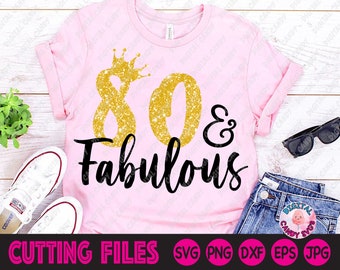 May include: Pink t-shirt with a gold glitter crown and the text "80 & Fabulous" in black.