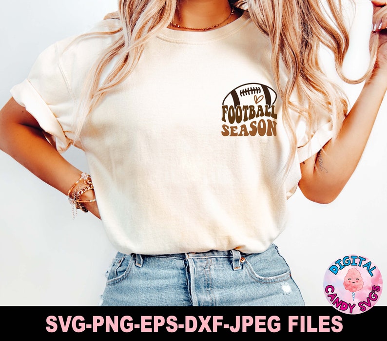 May include: A white t-shirt with a brown football graphic and the text "FOOTBALL SEASON" in brown letters. The football has a heart inside it.
