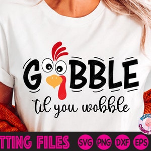 May include: White t-shirt with a black and red turkey graphic and the text "Gobble til you wobble".