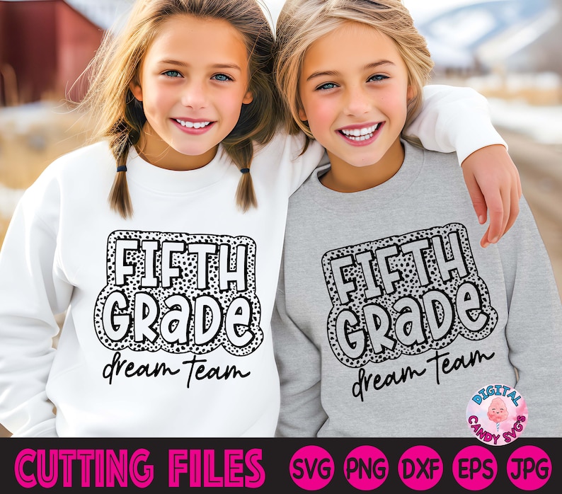 May include: Two children wearing white and grey sweatshirts with the text "FIFTH GRADE dream team" in black and white with a leopard print pattern. The text is in a bold, cartoon-like font.