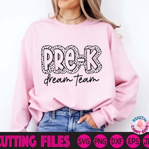 May include: Pink sweatshirt with black text that says "Pre-K Dream Team" in a black and white polka dot font.