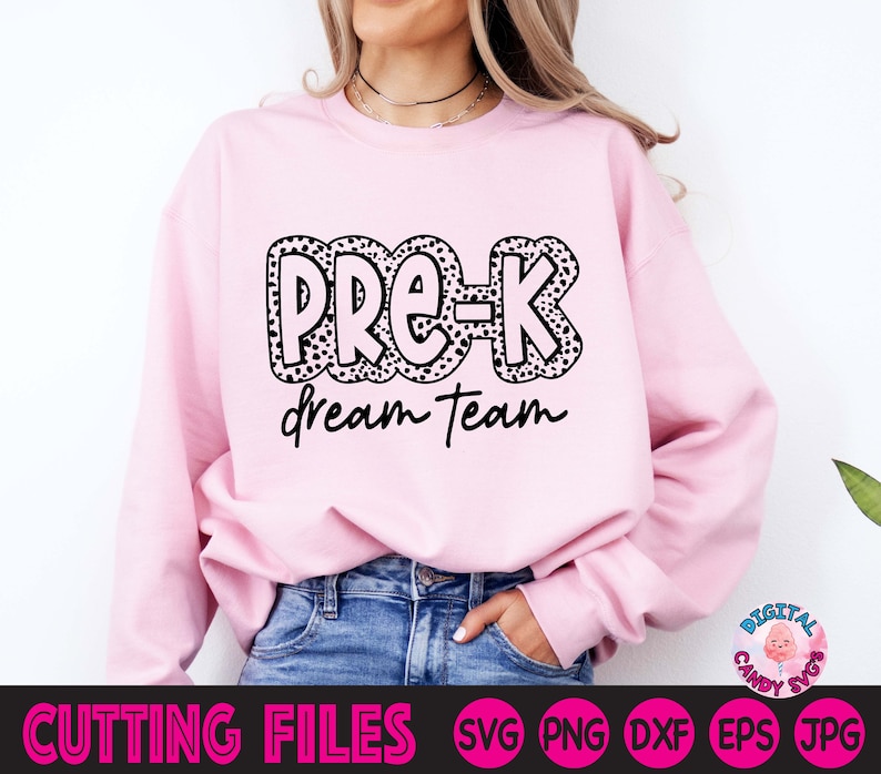 May include: Pink sweatshirt with black text that says "Pre-K Dream Team" in a black and white polka dot font.