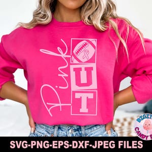 May include: Pink sweatshirt with a pink ribbon and football graphic. The text "Pink Out" is printed on the sweatshirt.