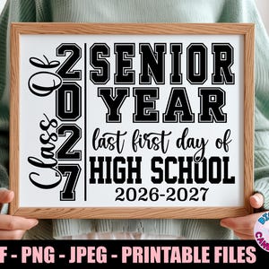 May include: A framed print with the text "Class of 2027 Senior Year" in black, with "last first day of HIGH SCHOOL 2026-2027" below. The frame is light brown.