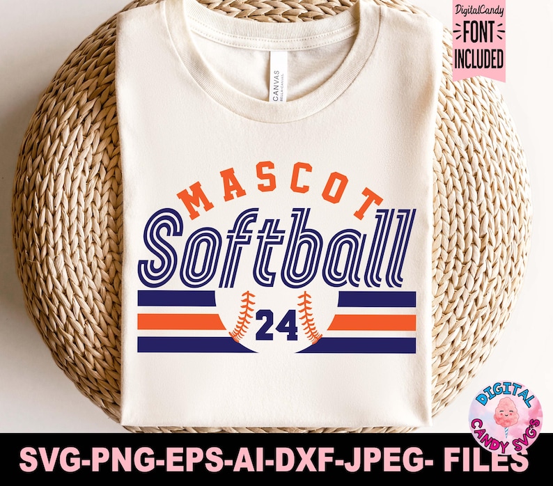 May include: A white t-shirt with a blue, orange, and white design that says "MASCOT Softball 24".