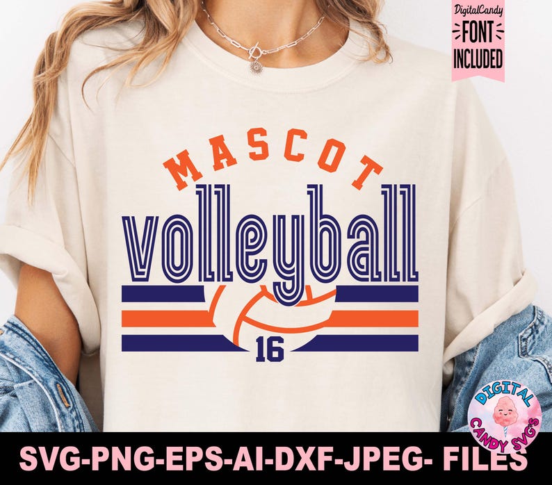 May include: A white t-shirt with a blue and orange volleyball design. The text "MASCOT volleyball 16" is printed on the shirt.