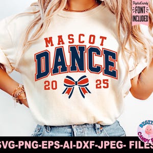 May include: White t-shirt with the text "MASCOT DANCE" in blue and red lettering with a red and blue bow in the center. The numbers 20 and 25 are on either side of the bow.