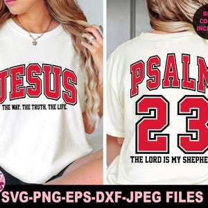 May include: Cream-colored t-shirt with the word "JESUS" in red block letters on the front, and "PSALM 23" on the back. The front of the shirt also has the text "THE WAY. THE TRUTH. THE LIFE." The back of the shirt has the text "THE LORD IS MY SHEPHERD."