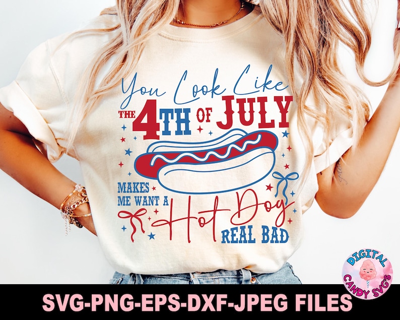 May include: Cream-colored t-shirt with a Fourth of July hot dog graphic. The design includes the text "You Look Like The 4th of July Makes Me Want A Hot Dog Real Bad" in red and blue. The image also includes the text "SVG-PNG-EPS-DXF-JPEG FILES".