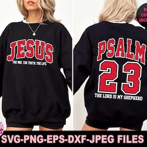 May include: Black sweatshirt with the word "JESUS" in red block letters on the front, and "PSALM 23" on the back. The text "THE WAY. THE TRUTH. THE LIFE." is below "JESUS". The text "THE LORD IS MY SHEPHERD" is below "23".