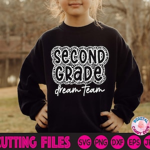 May include: A black sweatshirt with white text that says "Second Grade Dream Team" in a fun, playful font. The text is surrounded by a white polka dot pattern.