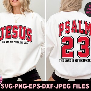 May include: White sweatshirt with the word "JESUS" in red, outlined in black, and the text "THE WAY. THE TRUTH. THE LIFE." below it. The back of the sweatshirt features "PSALM 23" and "THE LORD IS MY SHEPHERD" in red and black.