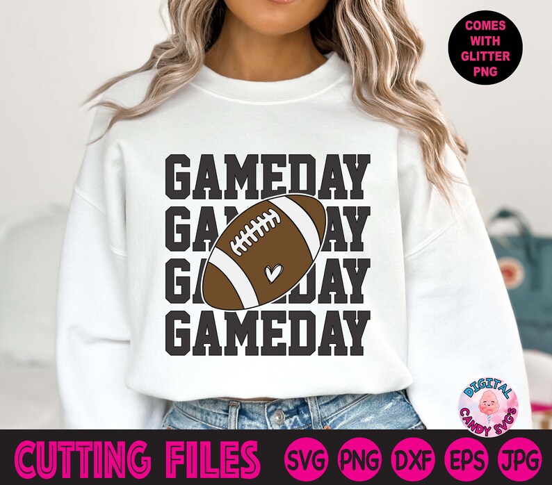 May include: White sweatshirt with the text "GAMEDAY" repeated four times in black. A brown and white football graphic is centred between the second and third lines of text.