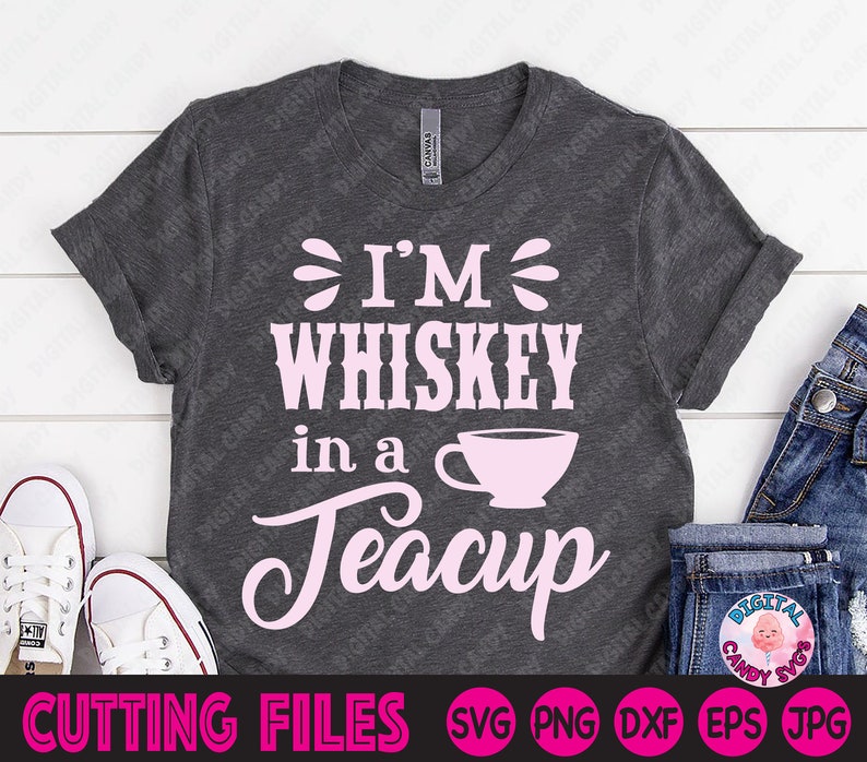 May include: A gray t-shirt with the text "I'm Whiskey in a Teacup" in pink lettering. The text is surrounded by a pink teacup graphic.