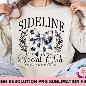 May include: A white sweatshirt with the text "Sideline Social Club Loud and Proud" and a black and white football bow.