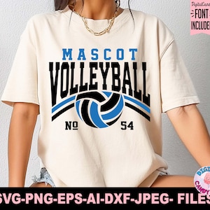 Puede incluir: Camiseta color crema con las palabras "MASCOT VOLLEYBALL" en negro y azul, con un gr&aacute;fico de voleibol. El n&uacute;mero "54" est&aacute; debajo del voleibol. La camiseta tambi&eacute;n incluye el texto "SVG-PNG-EPS-AI-DXF-JPEG- FILES".