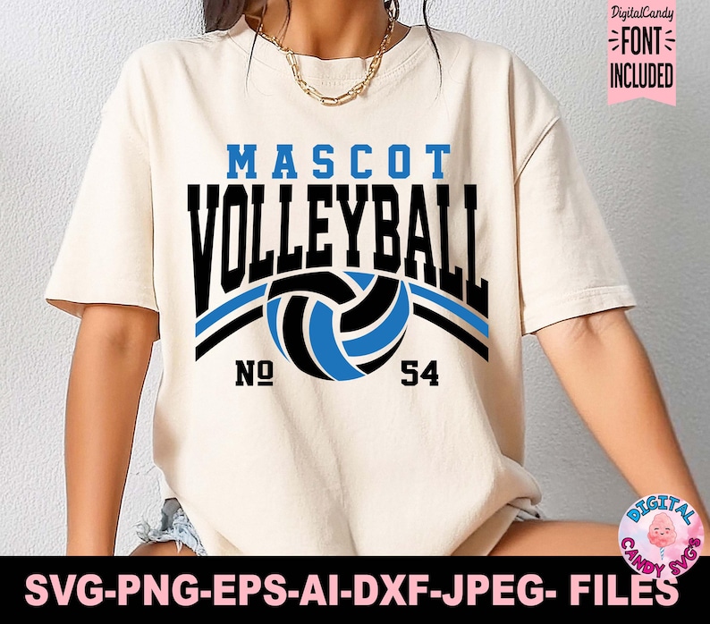 Puede incluir: Camiseta color crema con las palabras "MASCOT VOLLEYBALL" en negro y azul, con un gr&aacute;fico de voleibol. El n&uacute;mero "54" est&aacute; debajo del voleibol. La camiseta tambi&eacute;n incluye el texto "SVG-PNG-EPS-AI-DXF-JPEG- FILES".