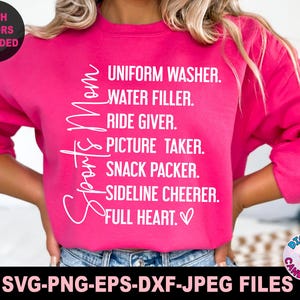 May include: Pink sweatshirt with the text "Sports Is Mom" and a list of duties: Uniform Washer, Water Filler, Ride Giver, Picture Taker, Snack Packer, Sideline Cheerer, Full Heart.
