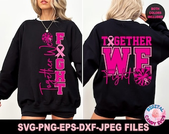 May include: A black long-sleeve sweatshirt featuring pink graphic designs. The front displays the text Together We Fight with a pink ribbon and pom-pom. The back features the text Together We Fight in large block letters with a pink ribbon.