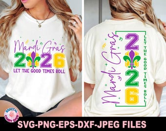 May include: Cream-colored t-shirt with a Mardi Gras design. The front features the text "Mardi Gras 2026" with a fleur-de-lis graphic. The back of the shirt also displays the Mardi Gras theme with the text "Let the Good Times Roll".