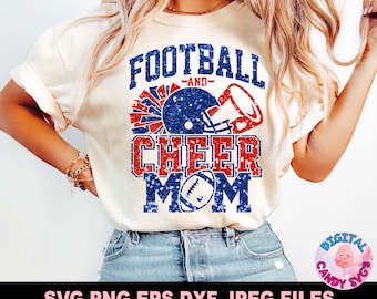 May include: A white t-shirt with a blue and red glitter design that says "Football -and- Cheer Mom". The design features a football helmet and a cheerleader's megaphone.