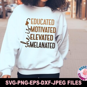 May include: White sweatshirt with brown text that reads "She is educated, motivated, elevated, melanated".