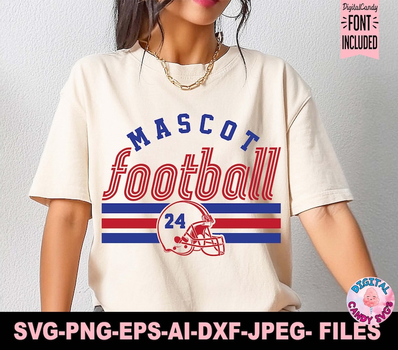May include: Cream-colored t-shirt with the words "MASCOT football" in blue and red. Below the text is a red and blue striped design with a football helmet and the number 24. The shirt includes the text "FONT INCLUDED".