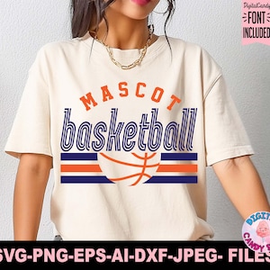 May include: Cream-colored t-shirt with the words "MASCOT basketball" in orange and blue. A basketball graphic is below the text, with orange and blue stripes. The shirt includes the text "FONT INCLUDED" and "SVG-PNG-EPS-AI-DXF-JPEG- FILES".