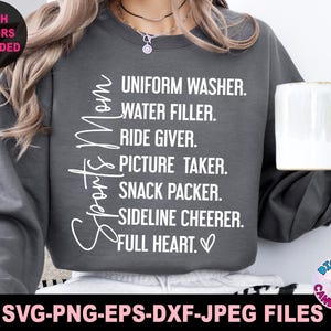 May include: Gray sweatshirt with the text "Sports Mom" and a list of duties, including "Uniform Washer", "Water Filler", "Ride Giver", "Picture Taker", "Snack Packer", "Sideline Cheer", and "Full Heart".