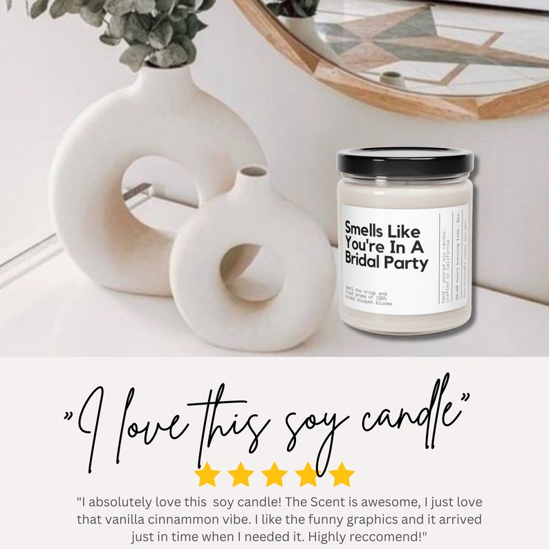 a white candle sitting on top of a table next to a vase