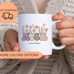 May include: White ceramic mug with a floral design and the text "NICU nurse" in colorful letters.