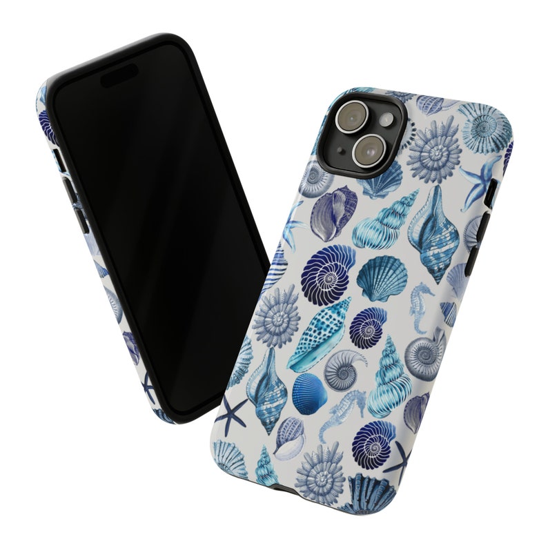 May include: A white iPhone case with a blue seashell pattern. The case has a black border and a camera lens cutout.