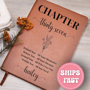 May include: A brown leather journal with the words "CHAPTER thirty seven" in black script. Below, it reads "Behind You - All Your Memories, Before You - All Your Dreams, Around You - All Who Love You, Within You - All You Need." The name "hailey" is also written on the journal.