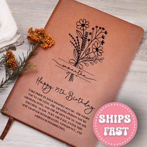 May include: A brown leather journal with a floral design and the name "samantha" in script. The journal is inscribed with "Happy 75th Birthday" and a message about pride and new beginnings. A pink "SHIPS FAST" sticker is visible.