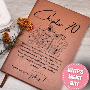 May include: A brown leather journal with the words "Chapter 70" and a floral design. The journal includes the text "Celebrate everything you've become..." and "Congratulations, Tiffany!"