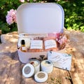 Luxury Suitcase Gift Box for Her , Self-Care Essentials, Scented Candles, Spa and Wellness Kit ,Perfect Gift for Relaxation & Pampering product logo