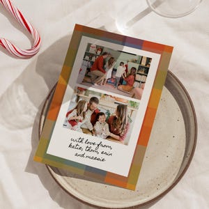 May include: A holiday greeting card with two family photos, framed by a colorful plaid pattern in shades of orange, green, and brown. The card includes the text "with love from, katie, thom, erin and maesie" in a handwritten style.