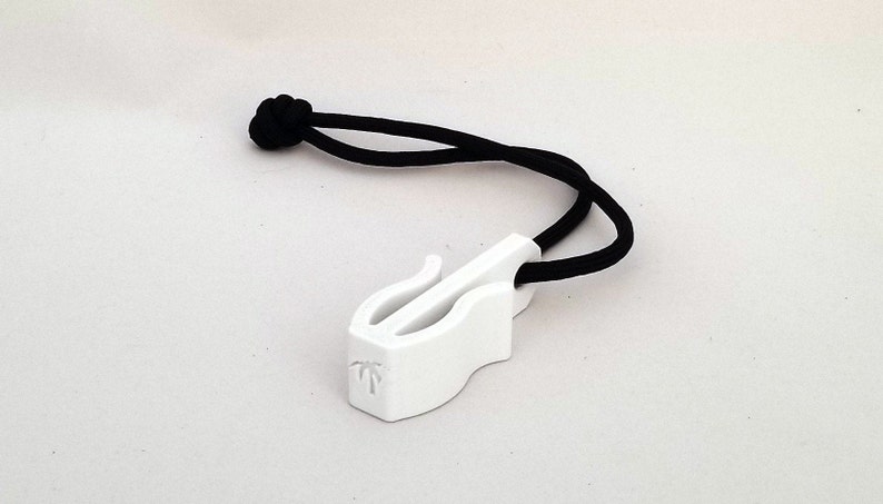 May include: A white plastic zipper pull with a black cord. The pull has a curved design with a slot and a small palm tree logo. The black cord is knotted at the end.