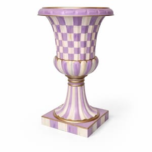 May include: A decorative urn with a square base, a fluted pedestal, and a bulbous body. The urn features a checkerboard pattern in lavender and white, with gold accents. The base and pedestal have vertical stripes in lavender and white.