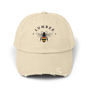 Lumbee-stammens slitna basebollkeps, design med inhemskt bi