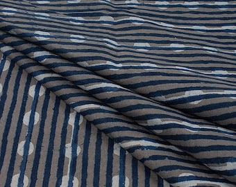 May include: Blue and white striped fabric with a repeating pattern of circles. The fabric has a textured, linen-like appearance.