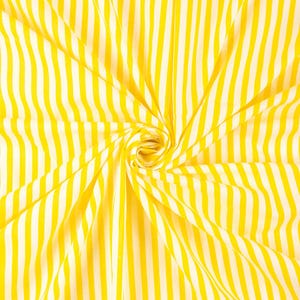 May include: Bright yellow and white striped fabric. The fabric is arranged in a spiral, with the stripes radiating from the center. The stripes are vertical and evenly spaced, creating a bold pattern.