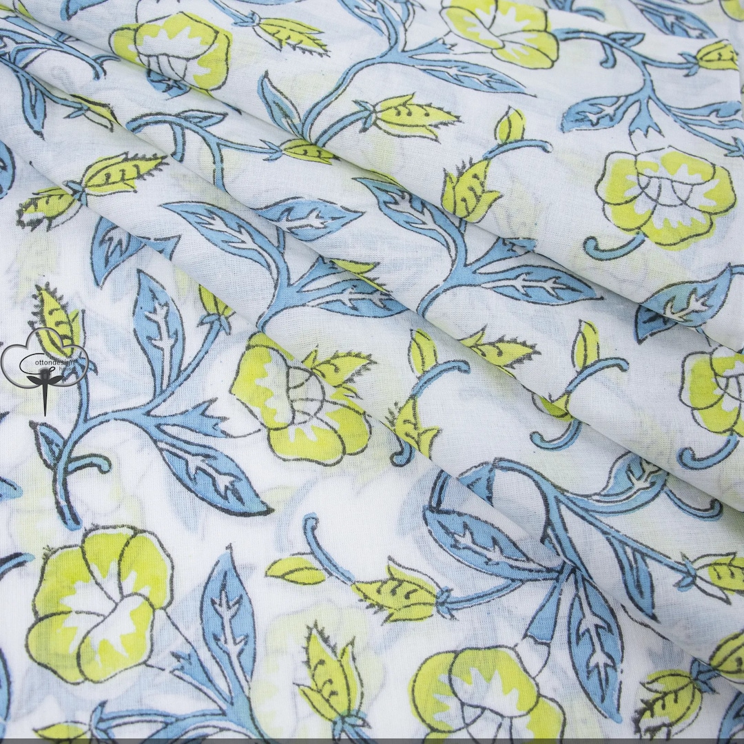 Off white cotton short top with quilted yoke and all-over blue & green floral hand block print.