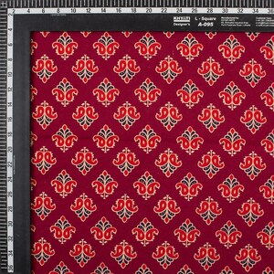 Hand block printed 100% cotton fabric featuring a traditional Indian floral pattern with intricate artisan detailing. Soft, breathable, lightweight fabric sold by the yard, ideal for sewing dresses, blouses, skirts, quilting, patchwork, home décor, cushion covers, curtains, table linens, tote bags, and a variety of DIY craft projects. Perfect for fashion designers, crafters, and handmade creations.