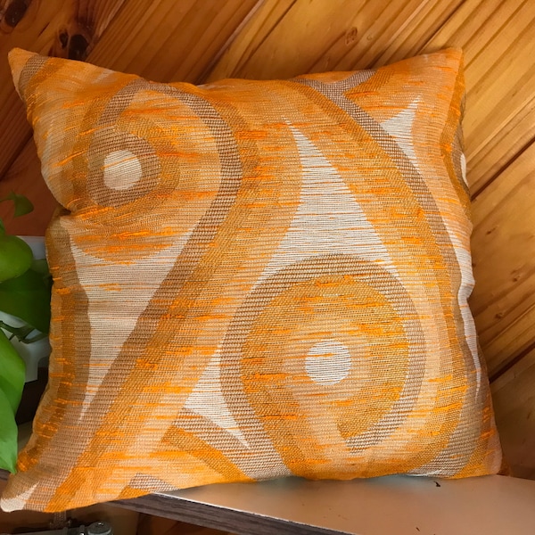 Funky vintage/retro cushion cover featuring groovy orange swirls.